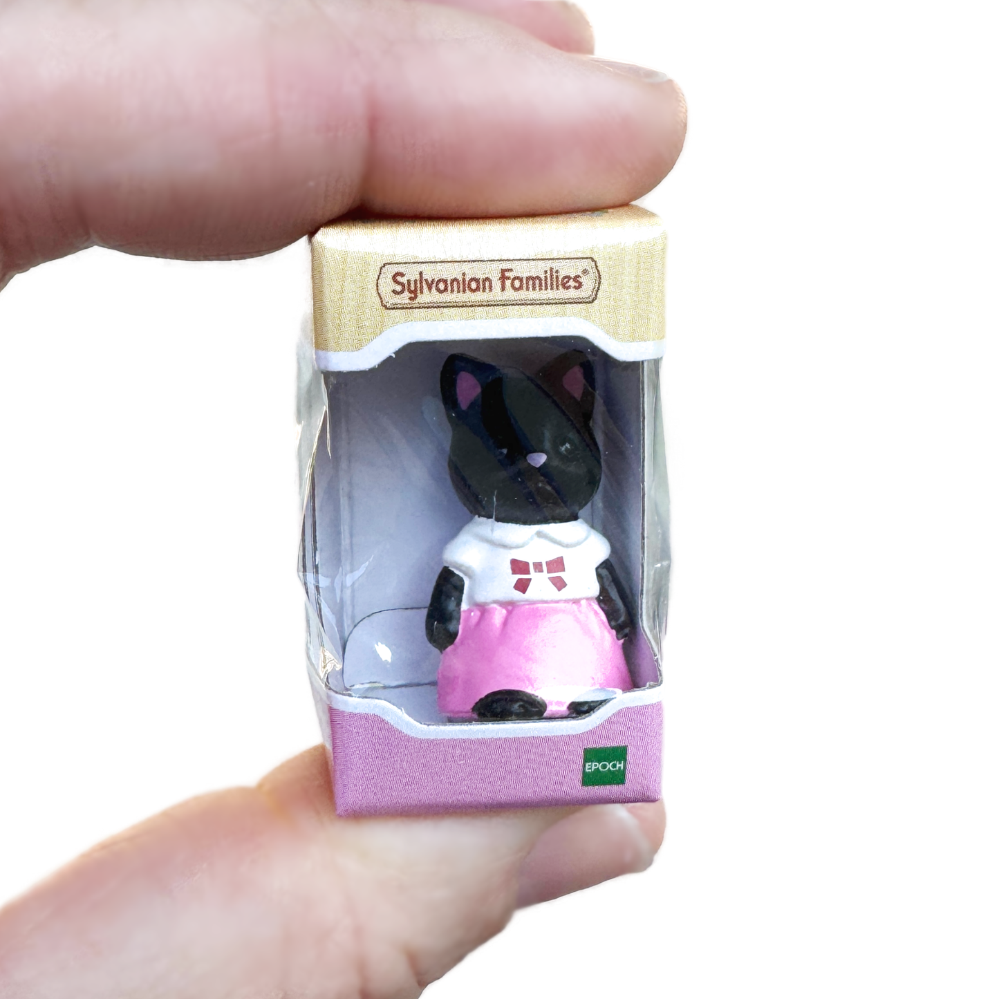 A hand holds the mini Midnight Cat in the Sylvanian Animals packaging.