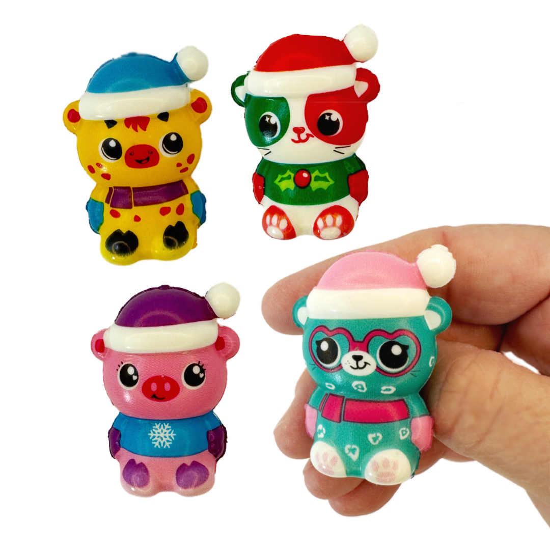 A hand is holding a micro squish toy and three other animal micro squish toys are pictured.