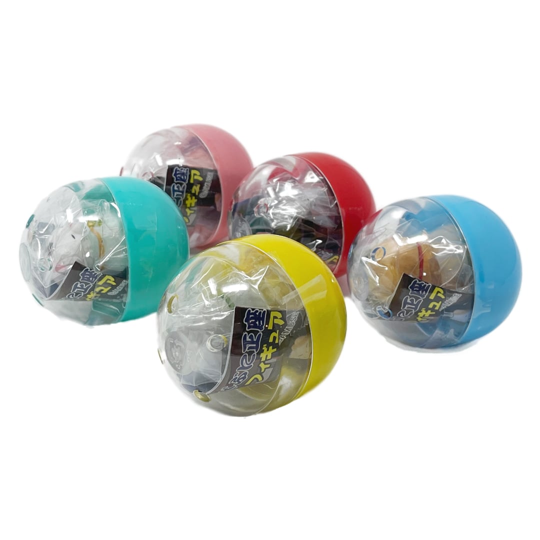Five colorful capsule toys with toy cat figurines inside.