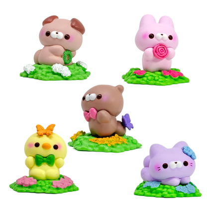 Five small toy critters sitting on hexagonal garden base plates