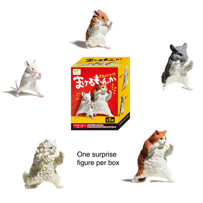 Collection of small fighting animal figurines with a box labeled 'One surprise figure per blind box' on a white background.