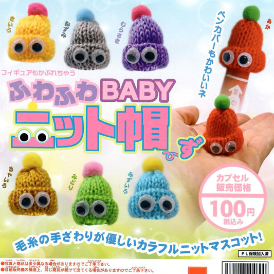 Japanese promotional gacahpon graphic for crocheted baby hats, showing multiple colorful knit hats with googly eyes and a hand holding one orange hat. 